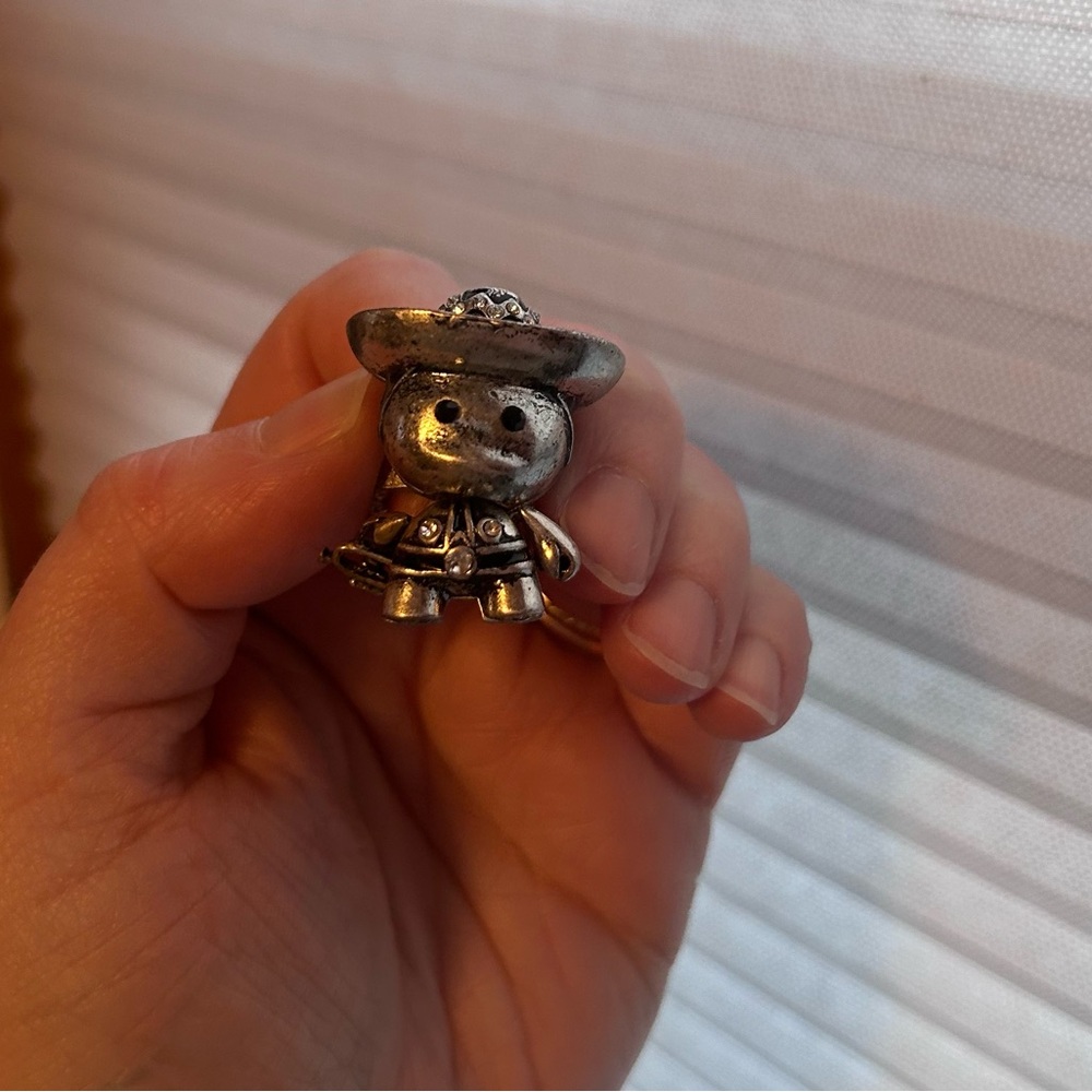 Silver Figurine with Hat and trumpet